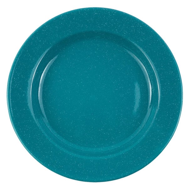 A turquoise plate with white specks and a speckled surface.