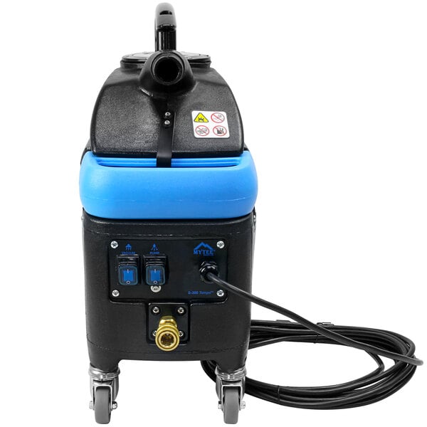 A Mytee Tempo upholstery spotter machine with a hose.