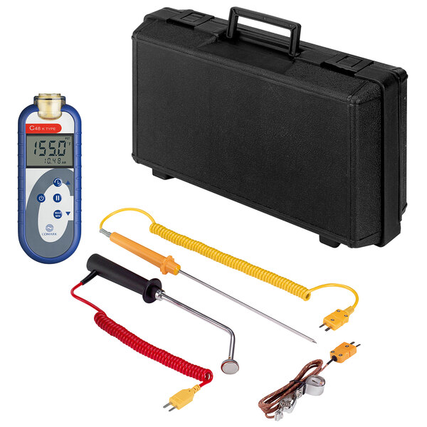 A black Comark hard carry case with a Comark type-K thermometer and yellow spiral cable.