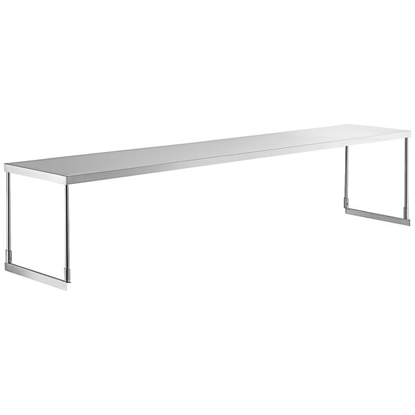 A long rectangular stainless steel shelf above a table.