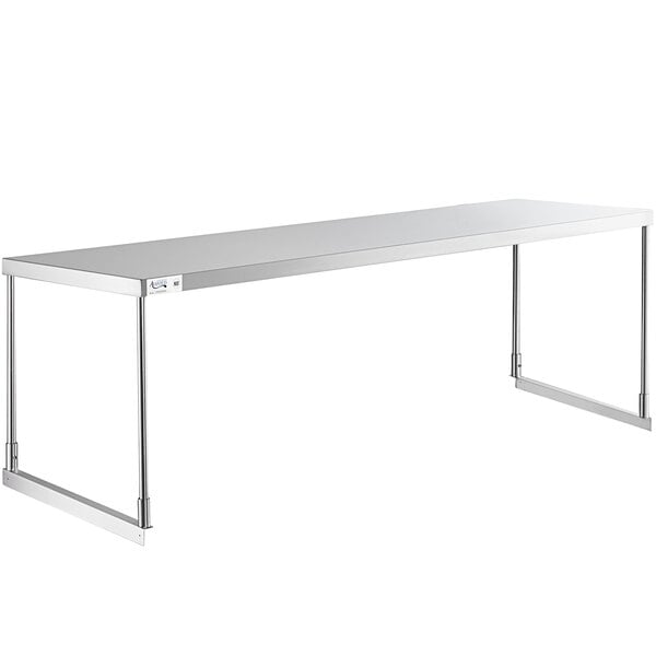 An Avantco stainless steel rectangular overshelf on a metal table.