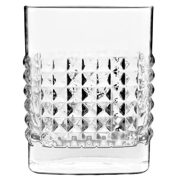 A close up of a Luigi Bormioli Elixir Rocks glass with a diamond pattern.