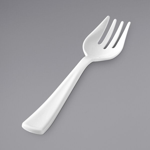 A white plastic Fineline serving fork.