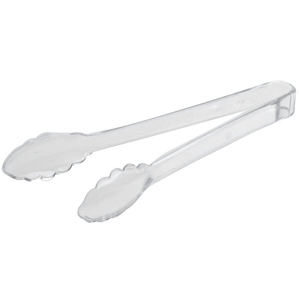 a pair of tongs with a white background