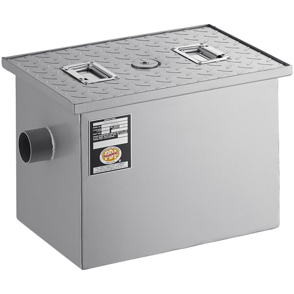 A grey metal rectangular box with 2 non-threaded pipes.