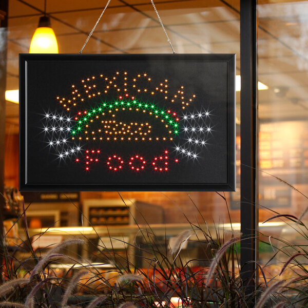 A rectangular LED sign that says "Mexican Food" with lights on it.