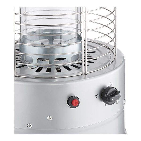 A round portable propane outdoor patio heater with a glass tube and metal safety grill.