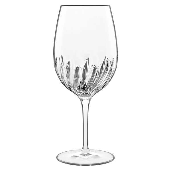 A close-up of a Luigi Bormioli Mixology Spritz wine glass with a clear stem.
