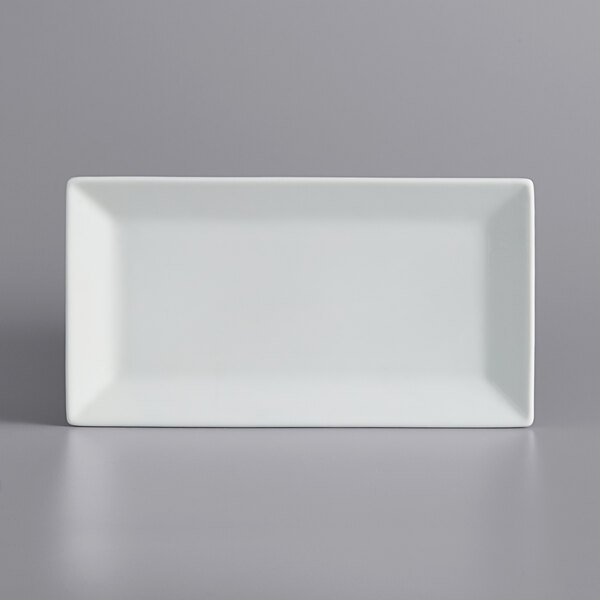 a white rectangular plate on a gray surface