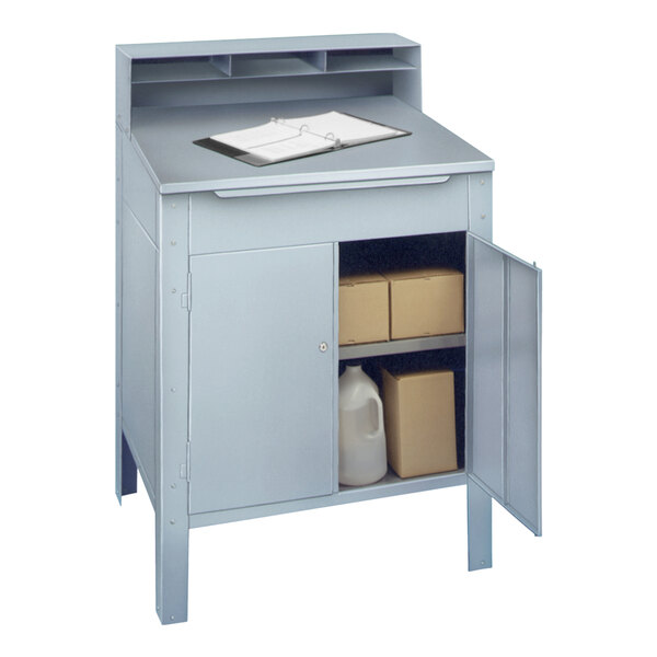 a small grey cabinet with a clipboard and a carton