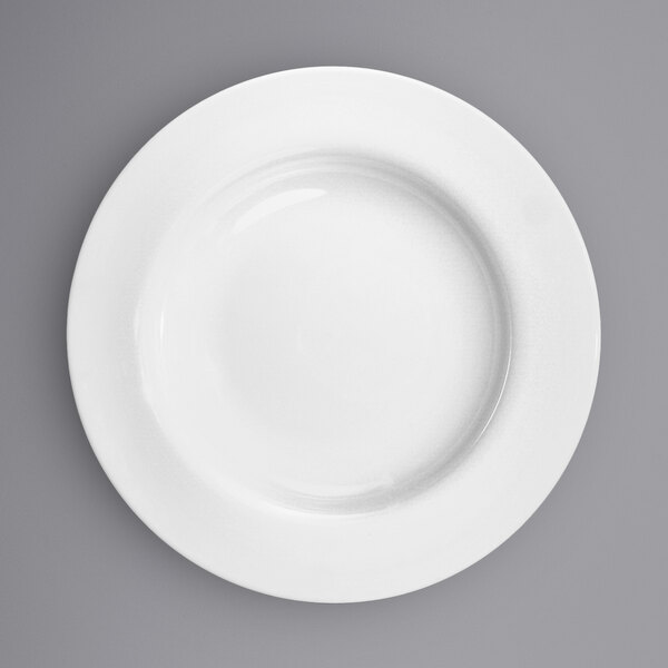 A close-up of a International Tableware Bristol bright white porcelain plate.