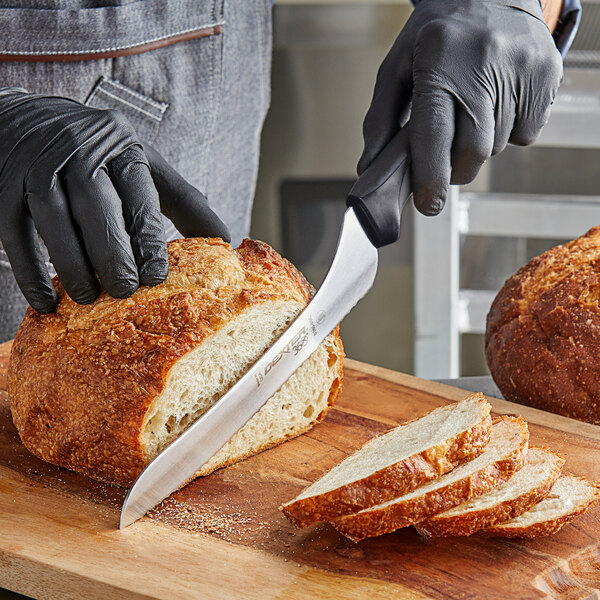 a person cutting bread with a knife