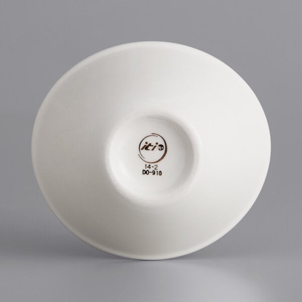 An International Tableware oval white porcelain bowl with a curved rim.