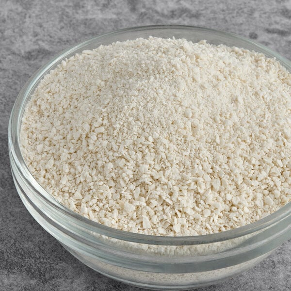 A bowl of Golden Dipt Matzoh Meal on a table.