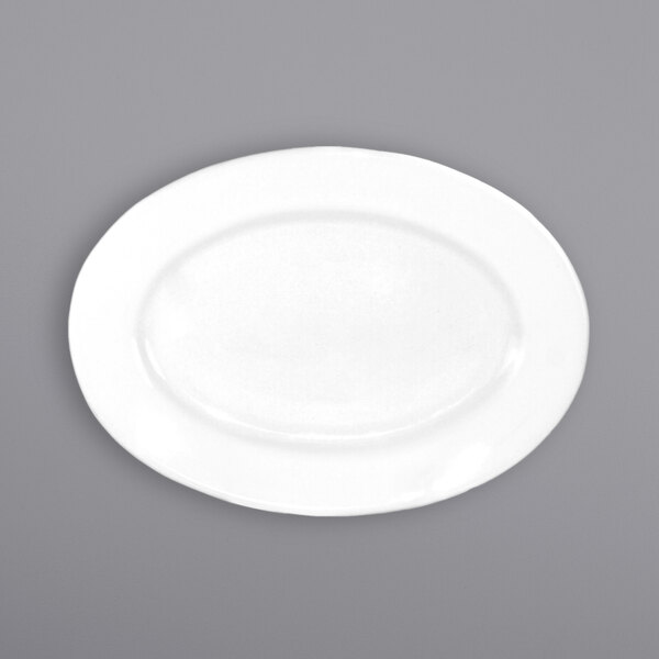 An International Tableware Dover porcelain platter with a wide white rim on a gray surface.