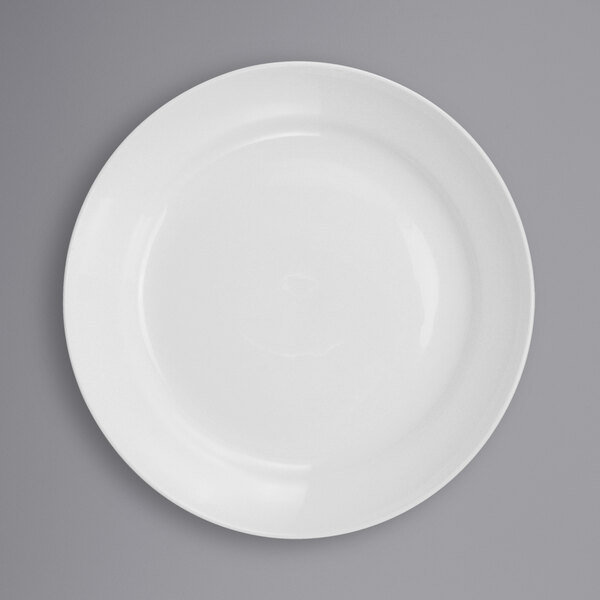 A close-up of a white International Tableware porcelain stadium bowl with a white rim.