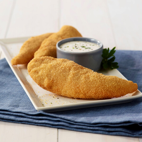 Golden Dipt All-Purpose Breading on fried fish sticks with a cup of sauce on a plate.