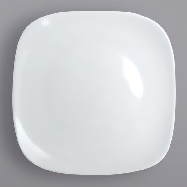 A white square International Tableware porcelain plate.