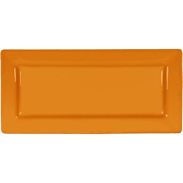 An orange rectangular International Tableware porcelain platter with a wide rim.