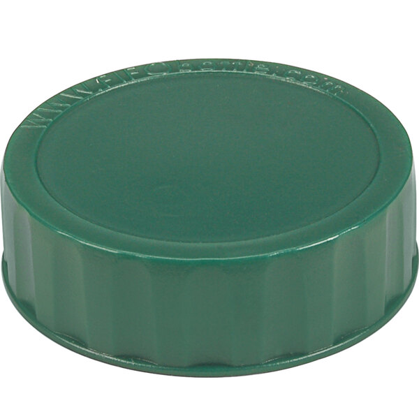 a green plastic bottle cap