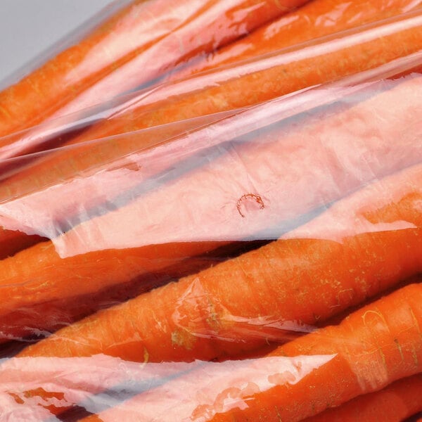Carrots in clear plastic produce bags.