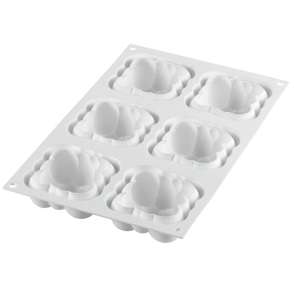 a white mold with two faces