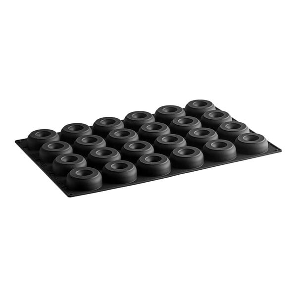 A black silicone baking tray with round black rings.