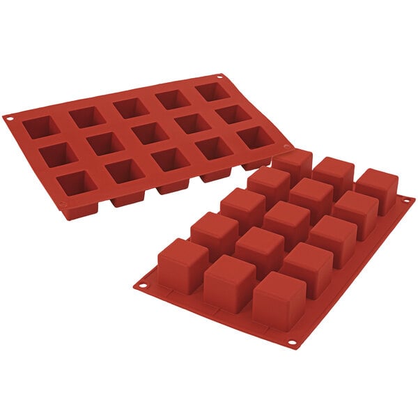 A red Silikomart silicone baking mold with 15 square cavities.