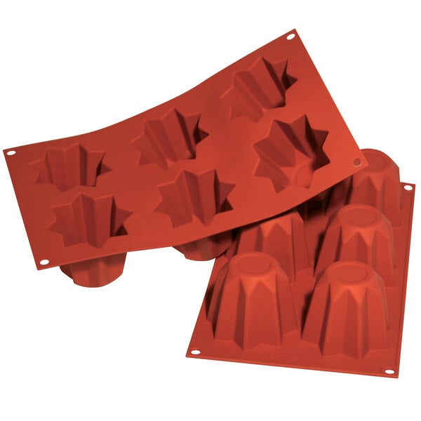 A close-up of a red Silikomart Pandorino silicone baking mold with 6 compartments.