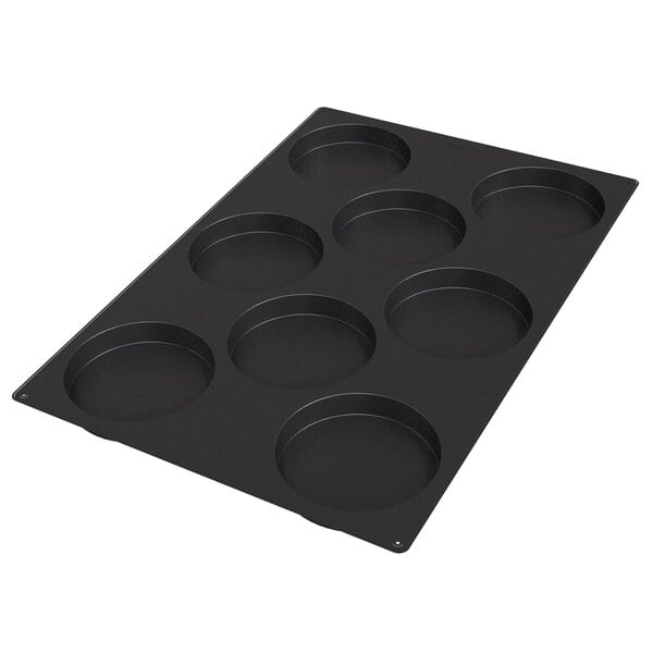 A black silicone baking mold with 8 square cavities.