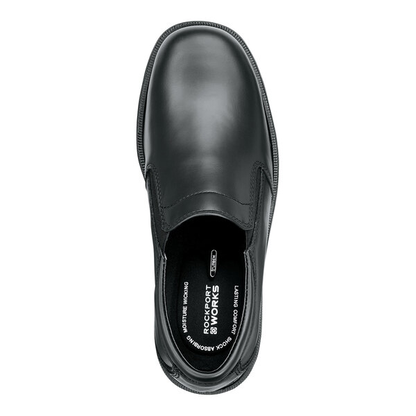 A black men's slip-on dress shoe with a soft toe and non-slip sole.