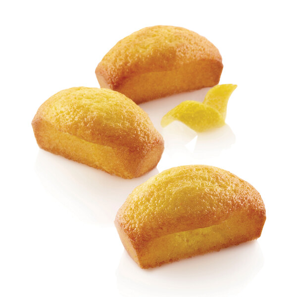 A group of Silikomart financiers baked in a silicone mold.