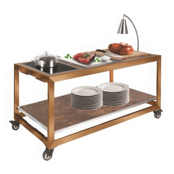 A table with a single arm stainless steel cone heat lamp over food on white plates.