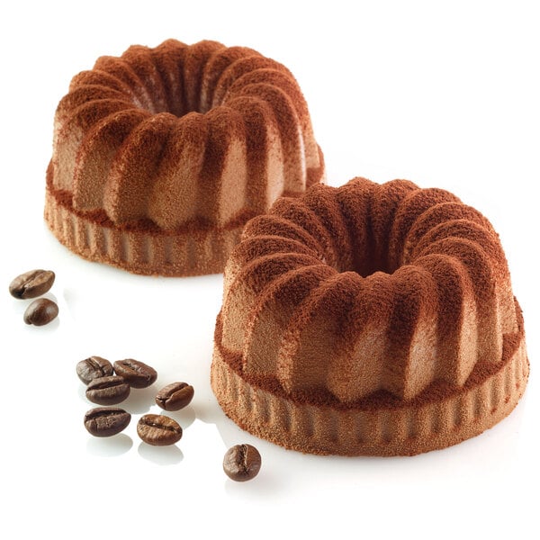 A close-up of two chocolate gugelhopf cakes made in a Silikomart silicone baking mold.