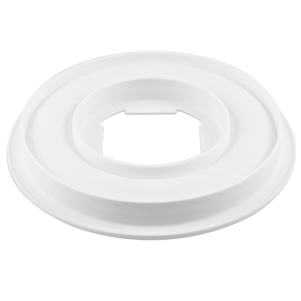 A white circular Silikomart silicone baking mold with a hole in the middle.