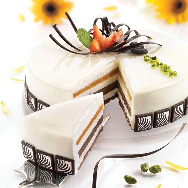 A close-up of a Silikomart silicone cake with a slice cut out of it.