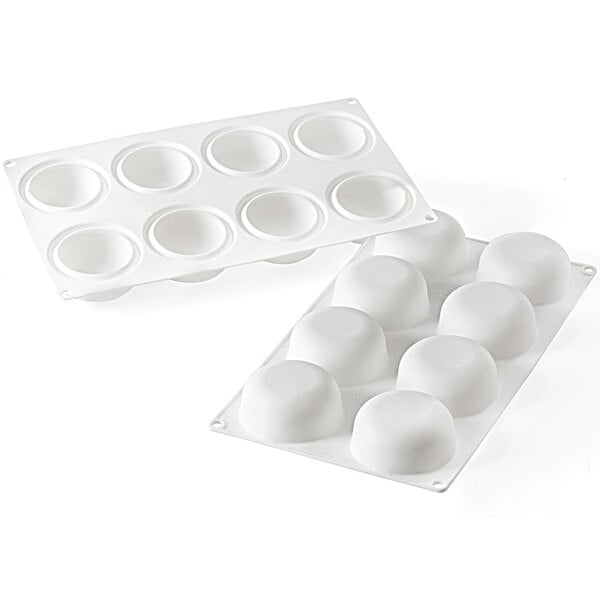A white silicone baking mold with 8 rectangular cavities.