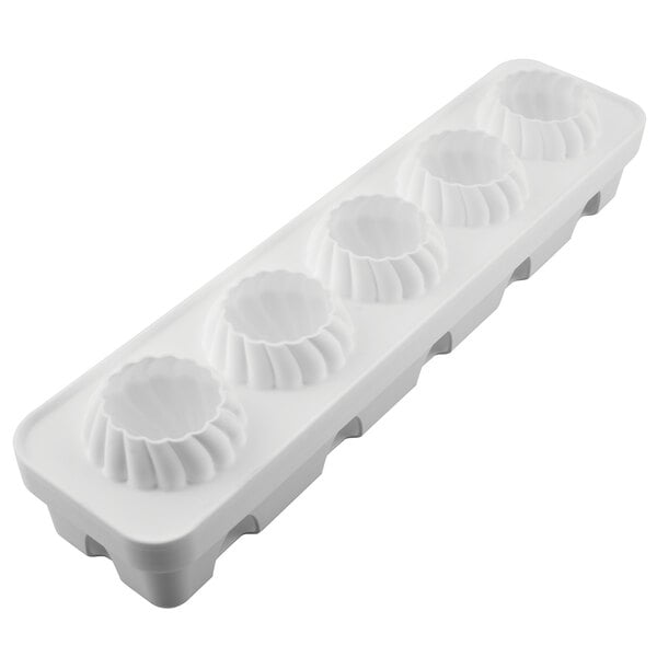 A white plastic mold with 5 circular compartments.
