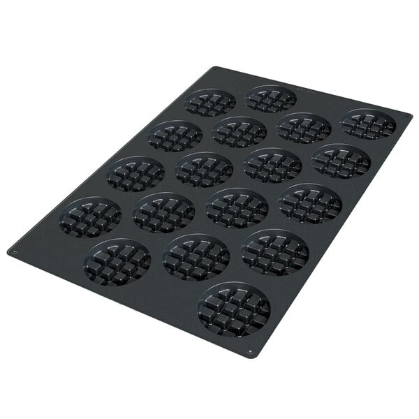 a black baking tray with holes