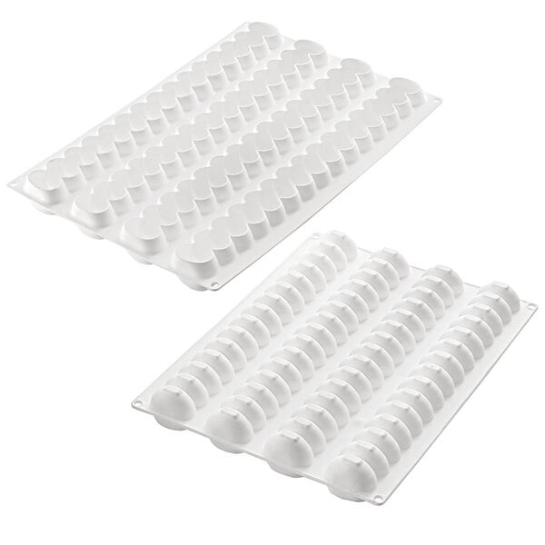 A white silicone baking mold with four rectangular compartments.