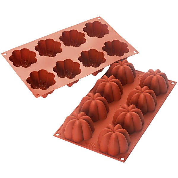 A Silikomart orange silicone mold with pumpkin shaped cavities.