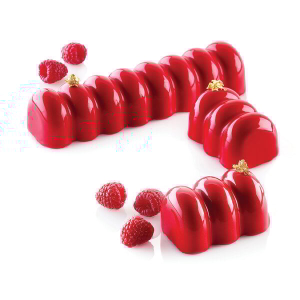 A red dessert with raspberries in a Silikomart silicone mold.
