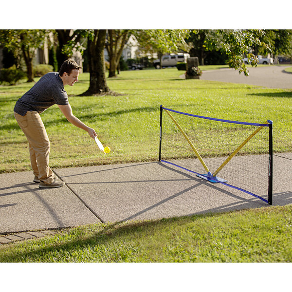 A man setting up a Triumph Multi-Sport net.