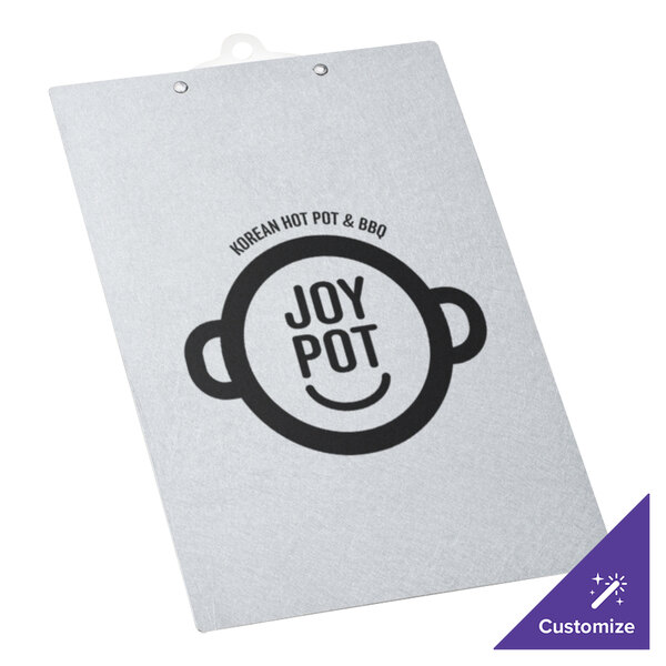 A white paper with the words "Joy Pot" on it clipped to a Menu Solutions Alumitique clipboard.
