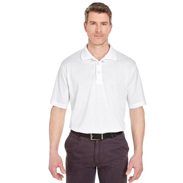 A man wearing a white Henry Segal short sleeve polo shirt.