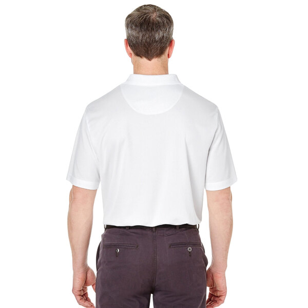 A man wearing a Henry Segal white polo shirt.