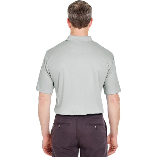 a man wearing a grey polo shirt