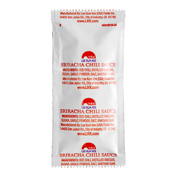 A close-up of a white Lee Kum Kee Sriracha sauce packet with red text.