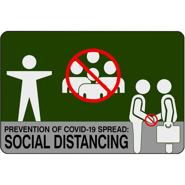 A green floor mat with white text and pictograms reading "Social Distancing" in a white circle.