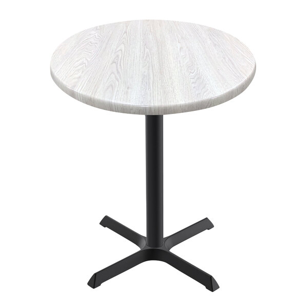 A white round Holland Bar Stool EnduroTop table with a cross base.